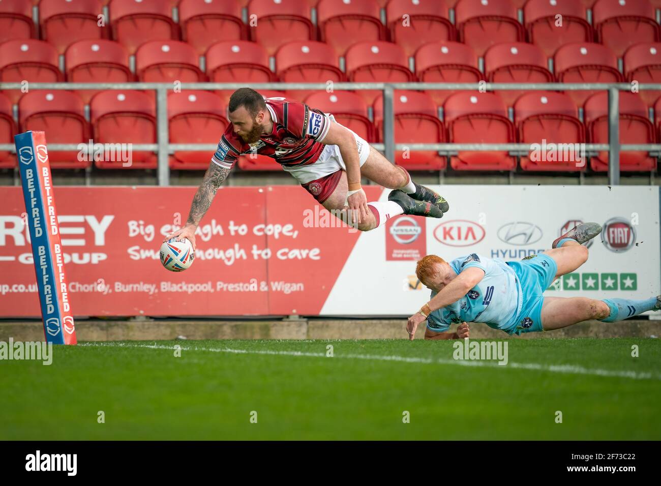 Wigan Warriors vs Wakefield Trinity Wigan Warriors's Jake Bibby scores