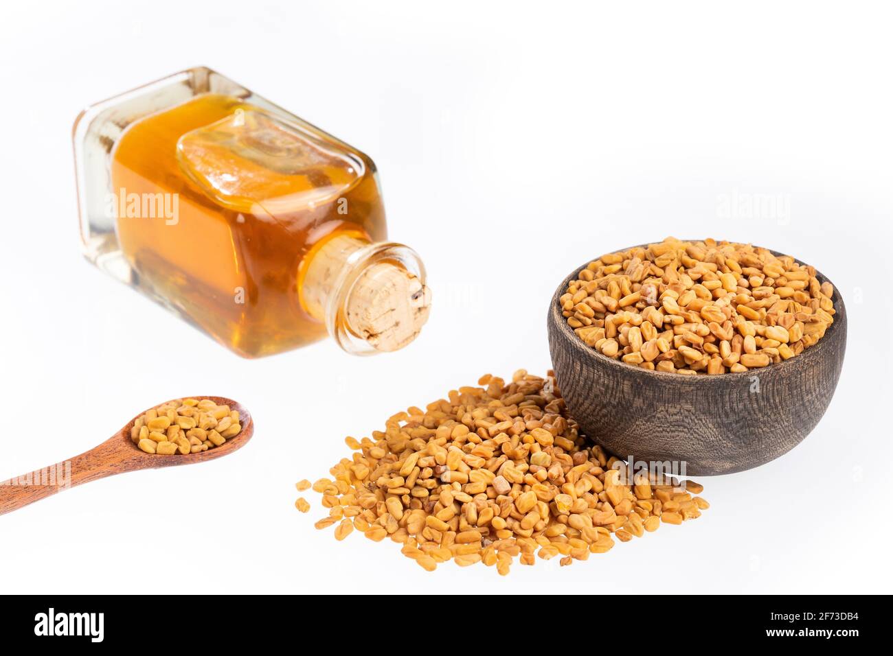 Fenugreek seeds and oil - Trigonella foenum - graecum Stock Photo