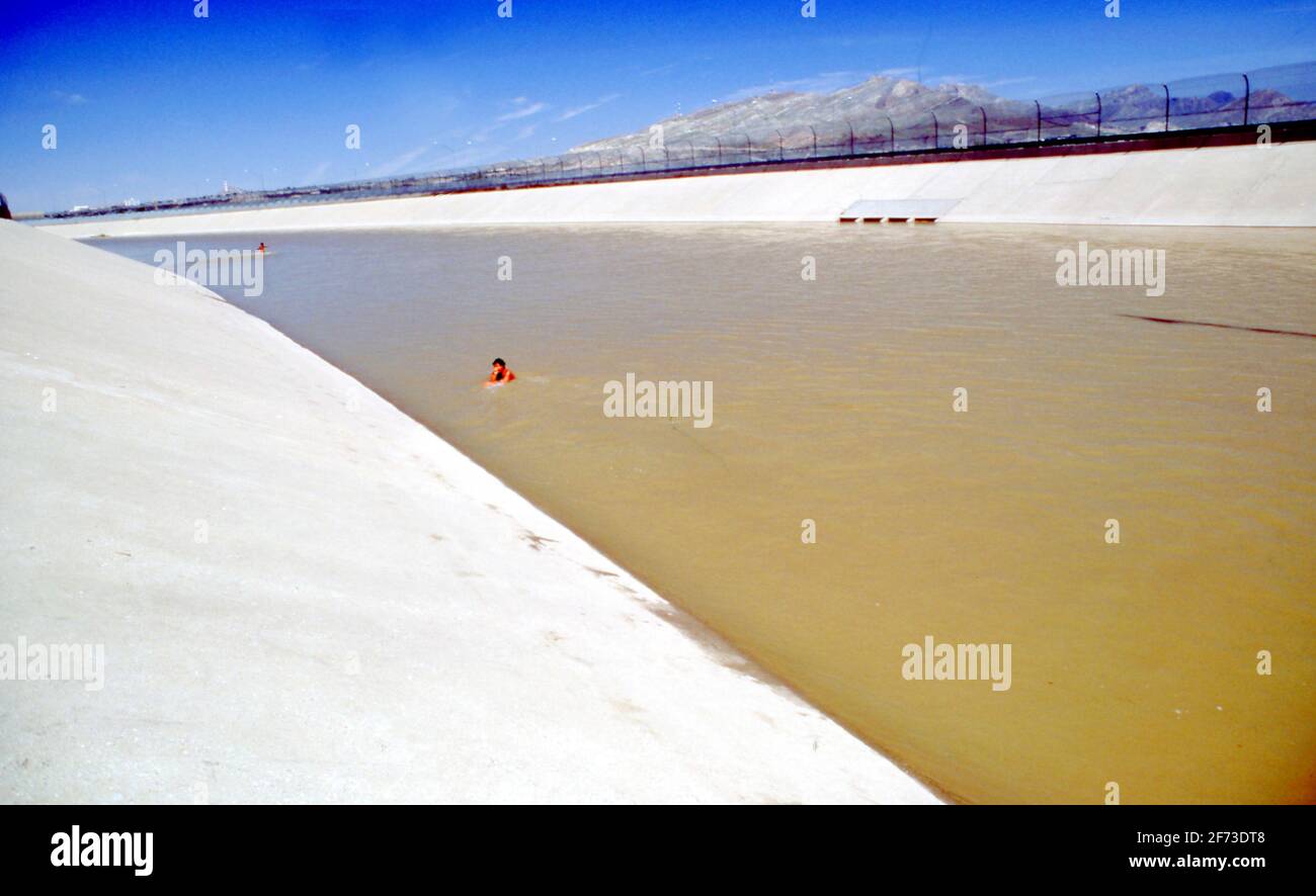 Man Swims Across Channelized Rio Grande River The International Border Between El Paso Texas Usa And Juarez Mexico Stock Photo Alamy