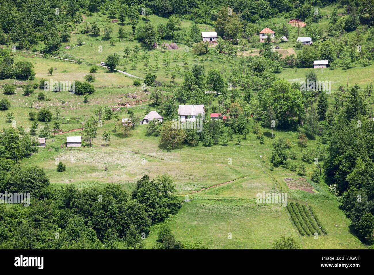Farms are on slopes of mountains in the Durmidor massif. Northwestern Montenegro, Europe Stock Photo