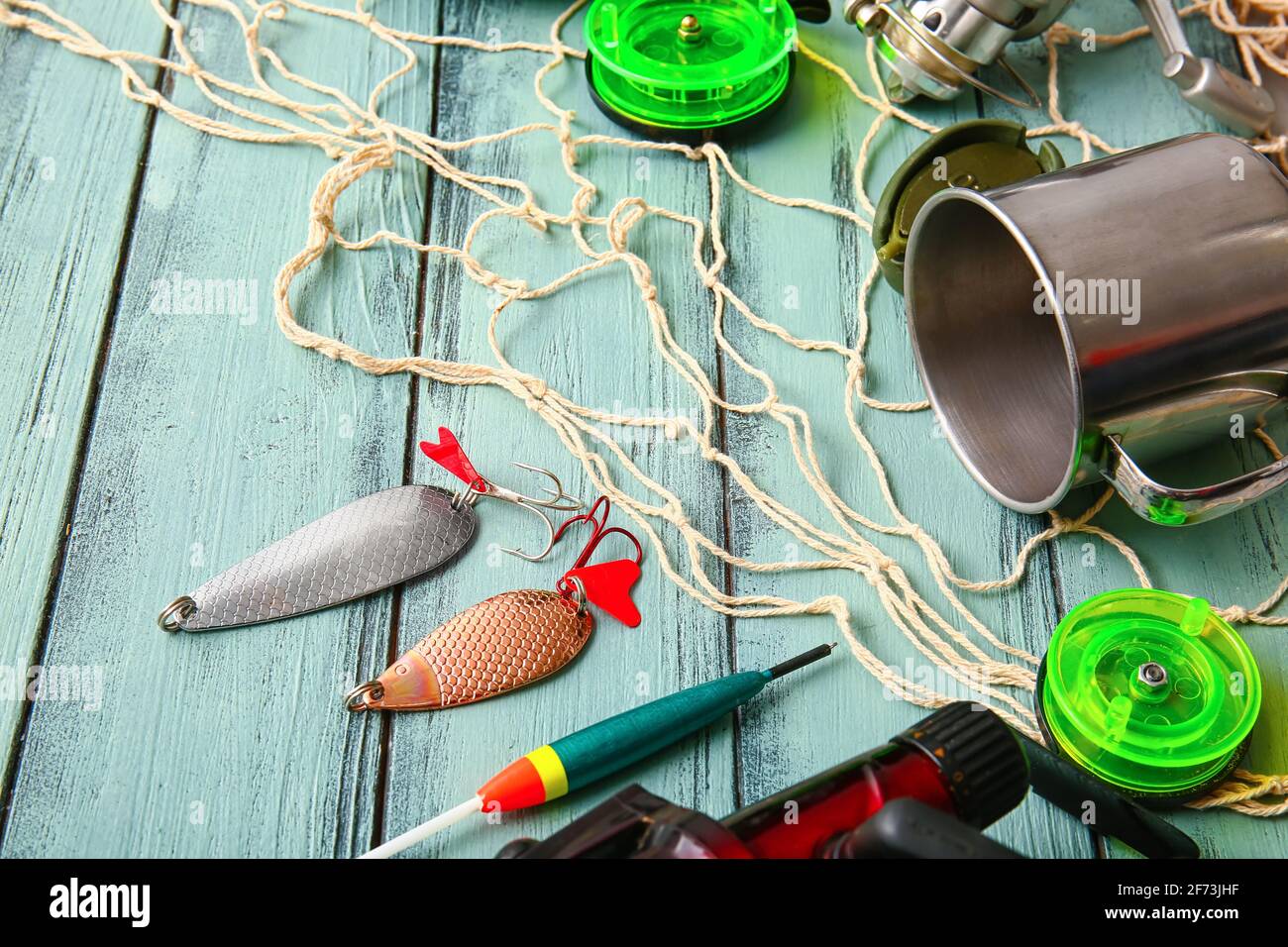 A Set of Items for Fishing, Bait with a Hook, a Reel with a Fishing Line  and a Fishing Rod, on a Light Background Stock Photo - Image of freshwater,  accessories: 175010410