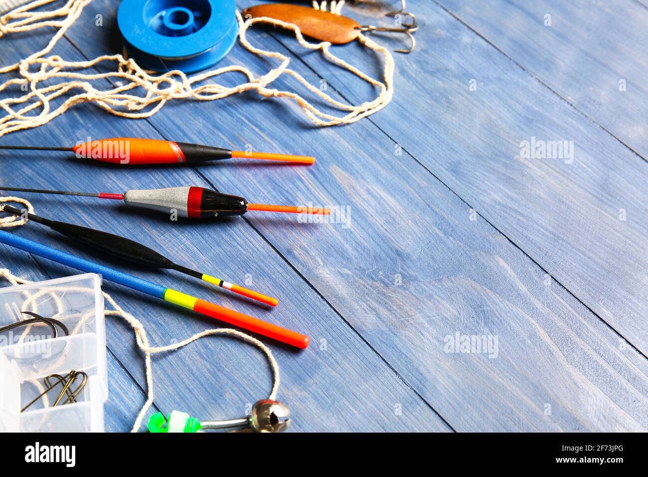Top view of two colorful fishing rod bobbers on a black background Stock  Photo - Alamy