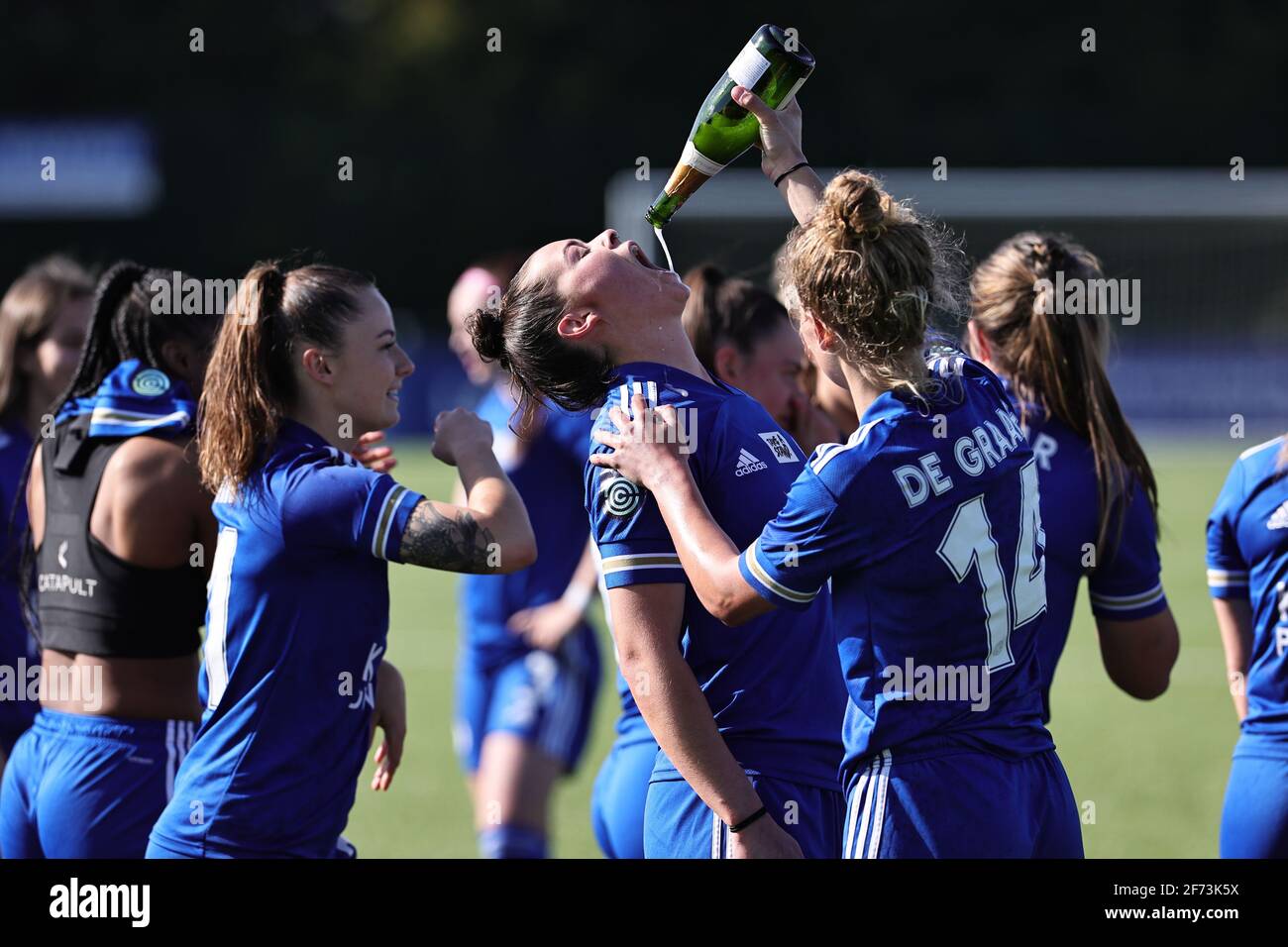 LOUGHBOROUGH, UK: Esmee De Graaf of Leicester City helps her teammate Natasha Flint celebrate after promotion to the WSL after the FA Women's Championship match between Leicester City and London Lionesses at Farley Way Stadium, Quorn, Loughborough on Sunday 4th April 2021. (Credit: James Holyoak | MI News) Credit: MI News & Sport /Alamy Live News Stock Photo