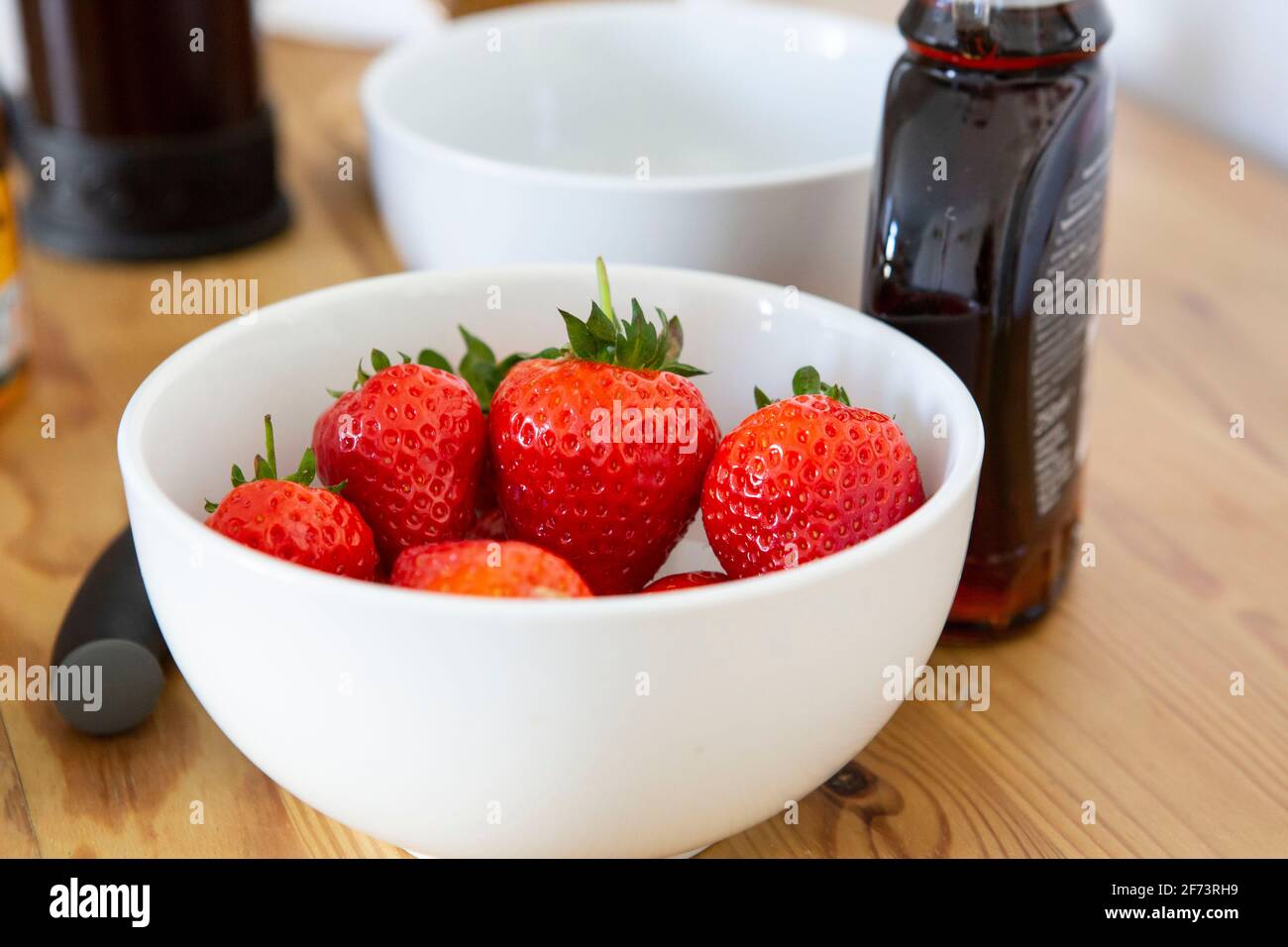 Strawberries and maple syrup Stock Photo Alamy
