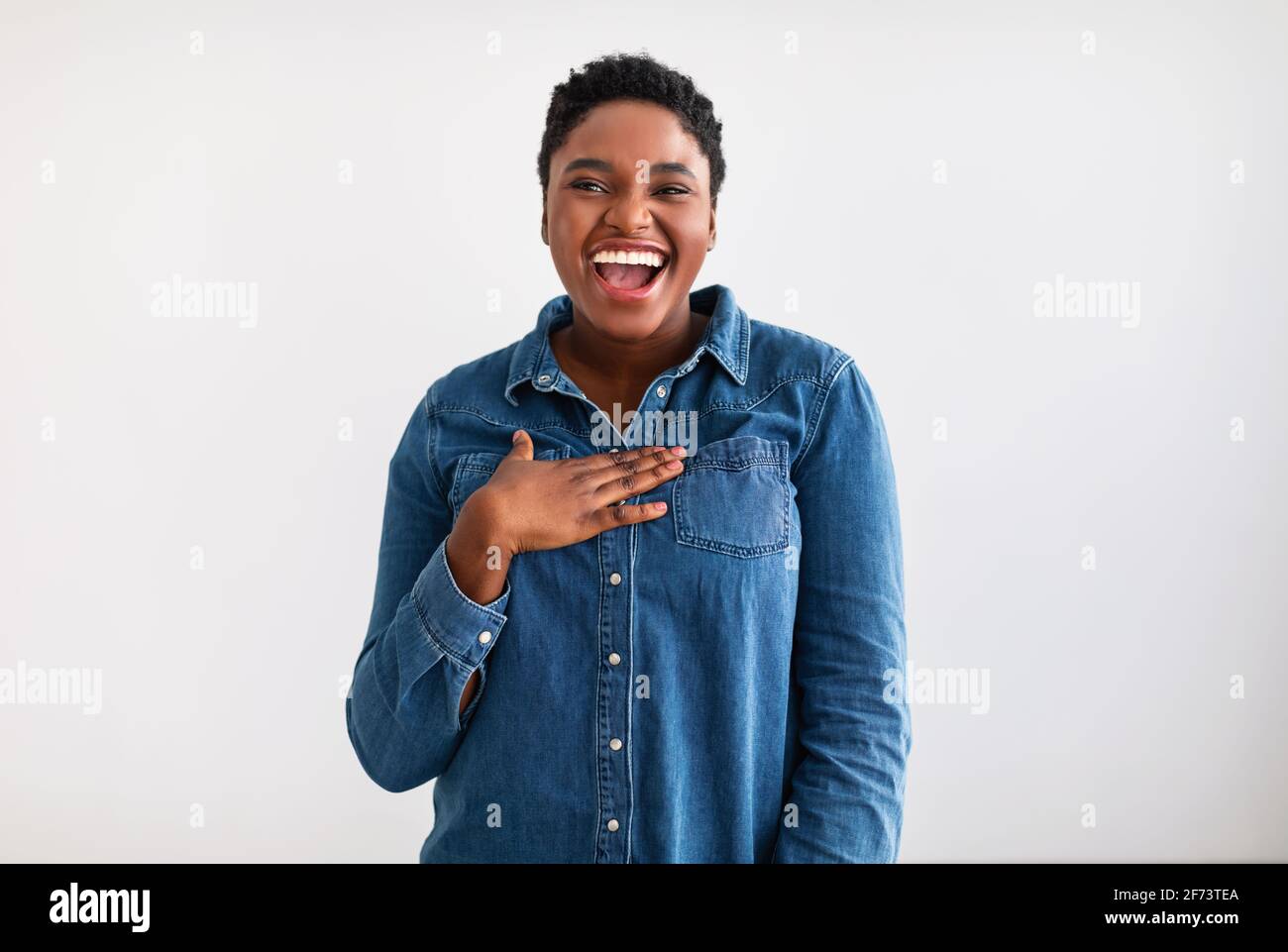 Portrait of casual young black woman laughing Stock Photo - Alamy