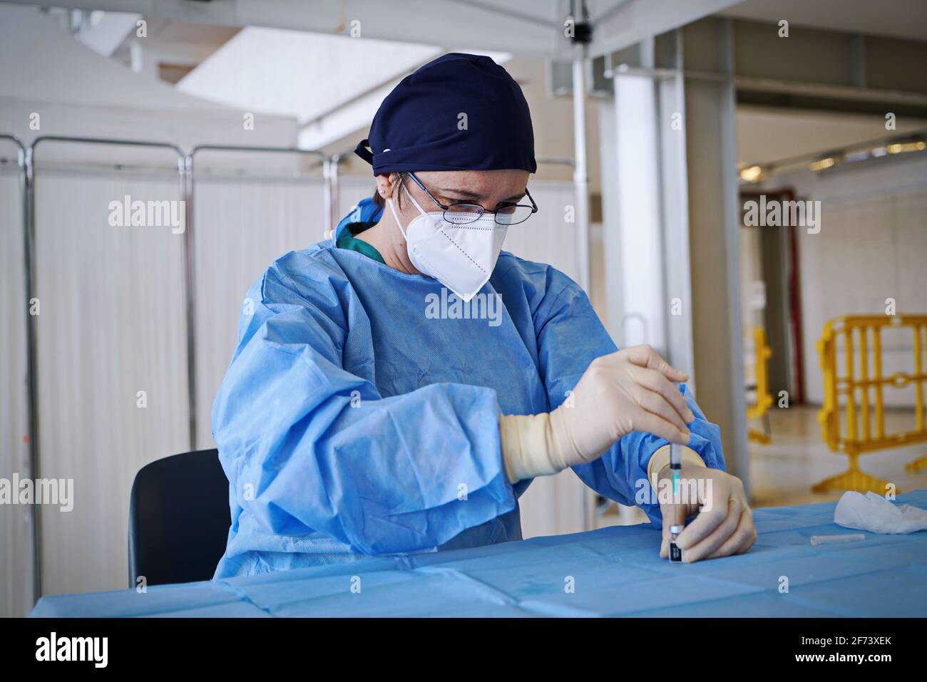Preparation of syringes with dose of vaccine ready for inoculation in Italian vaccination centre. Turin, Italy - April 2021 Stock Photo