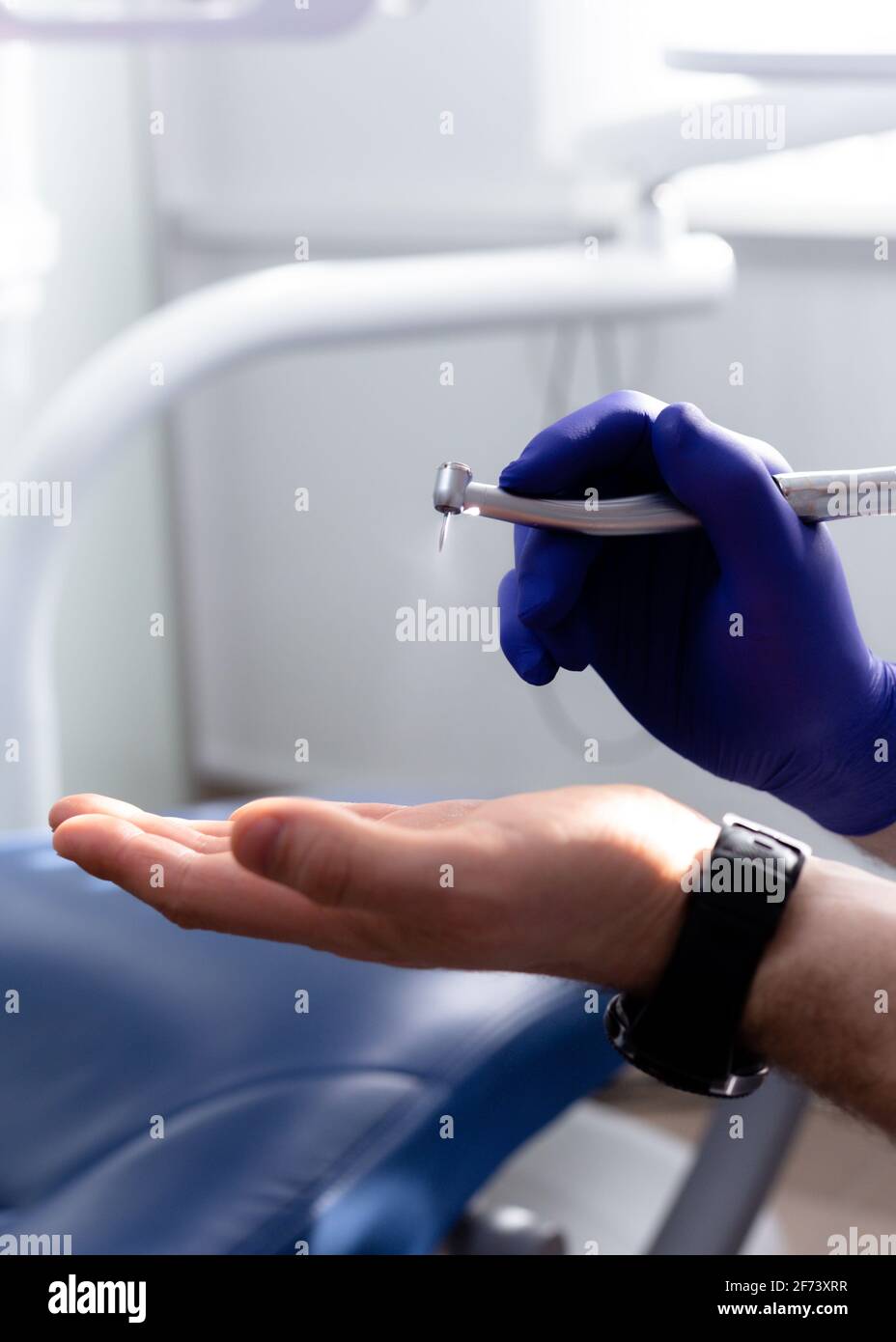 Drill in hand at the dentist. Dental equipment Stock Photo Alamy