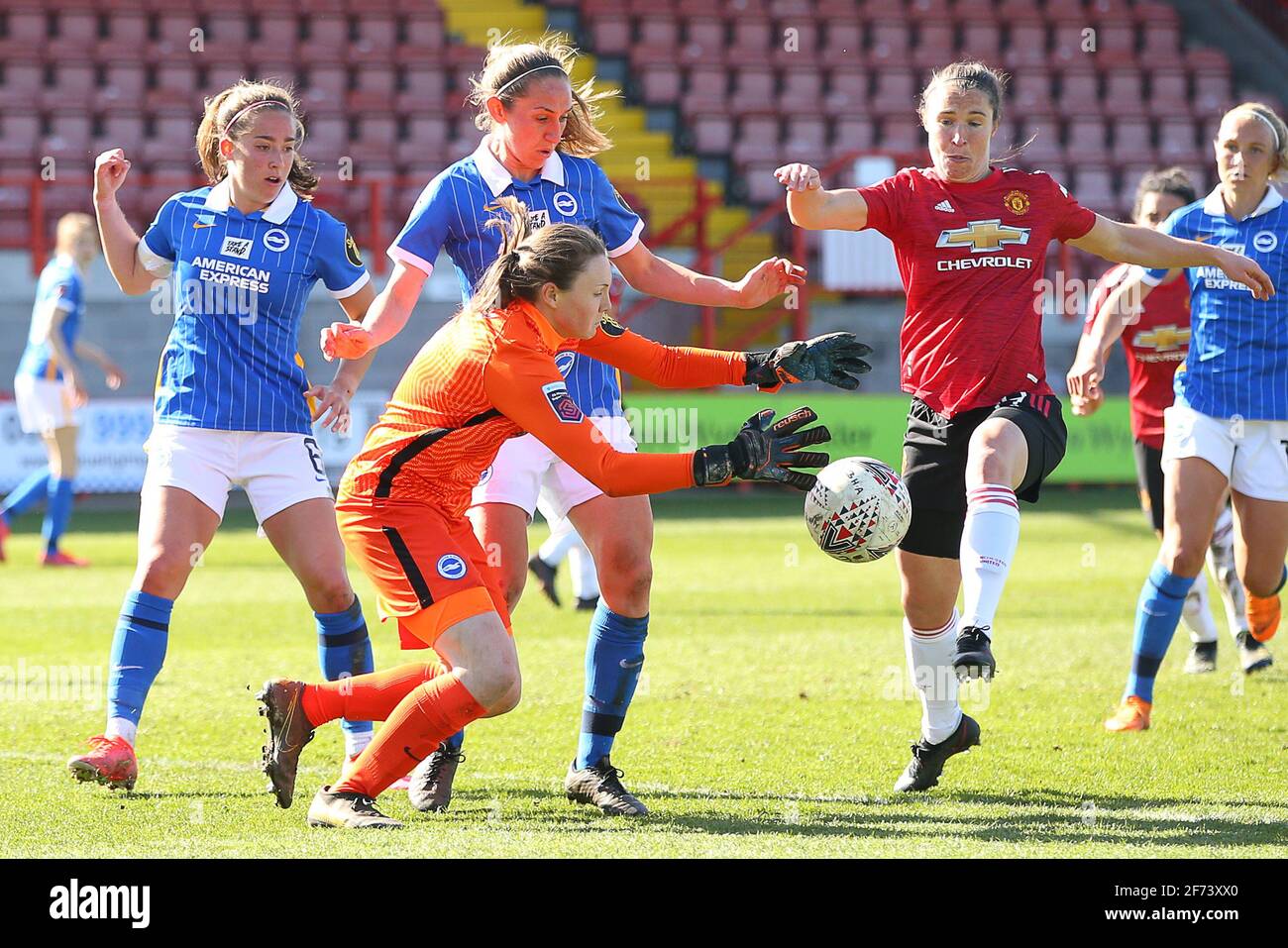 Crawley, UK. 4th Apr, 2021. Megan Walsh of Brighton and Hove Albion collects the ball ahead of Jane Ross of Manchester United during the FA Women's Super League match between Brighton & Hove Albion Women and Manchester United Women at The People's Pension Stadium on April 4th 2021 in Crawley, United Kingdom Credit: Paul Terry Photo/Alamy Live News Stock Photo