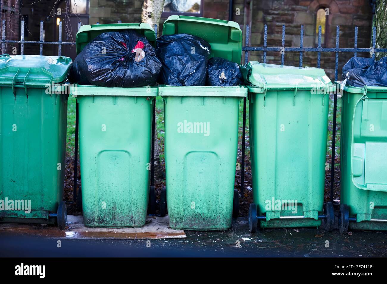 Fly tipping of waste and rubbish black bin bags in residential area