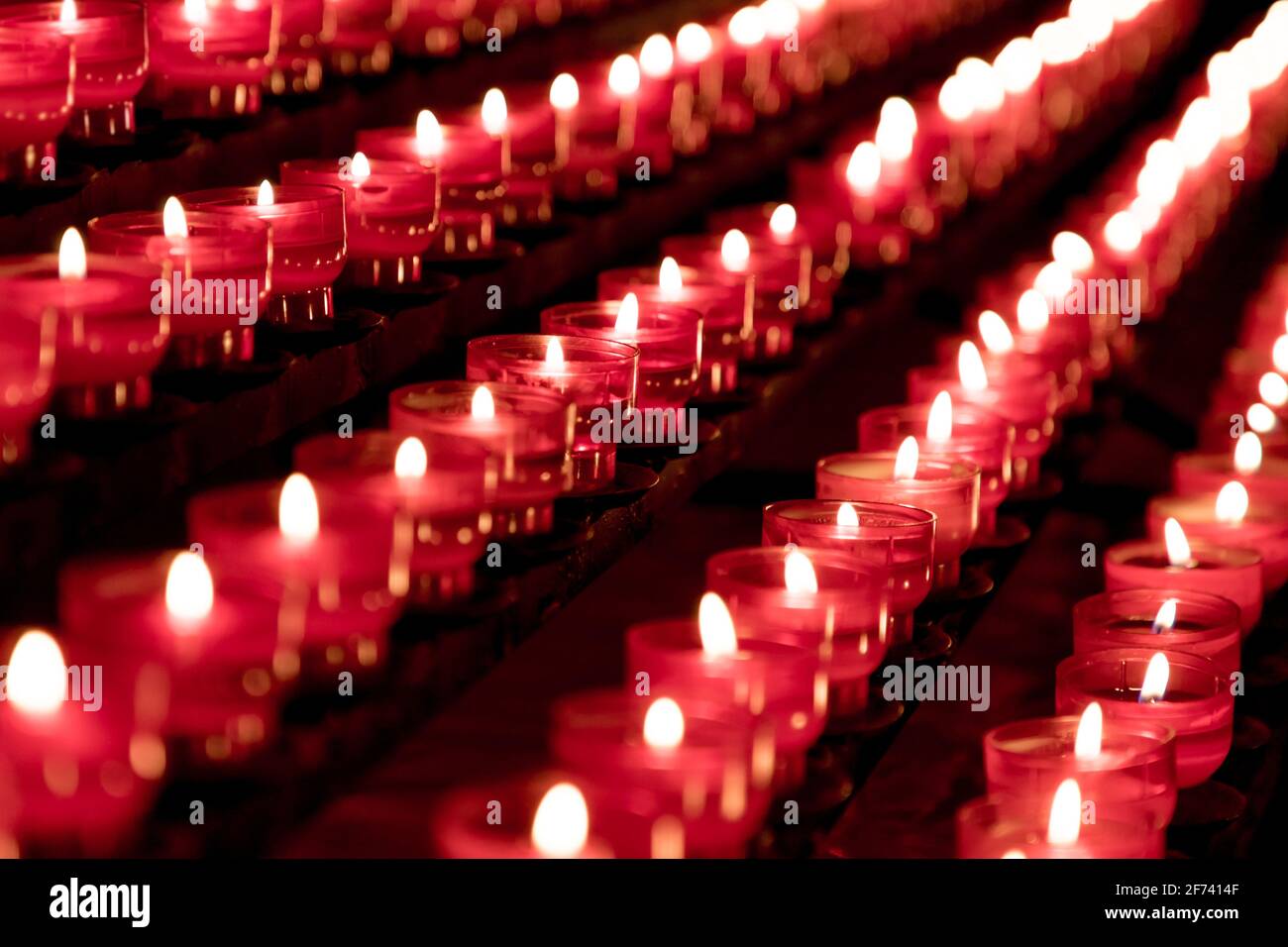 Group of red candles in church for faith resurrection prayer
