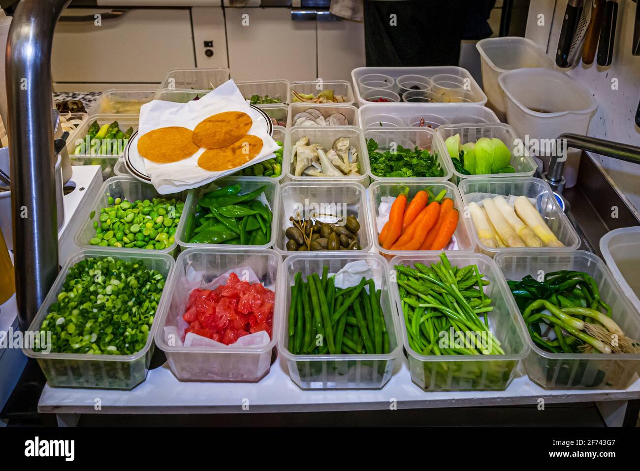 In the kitchen, all herbs are finely cut and prepared for use Stock Photo