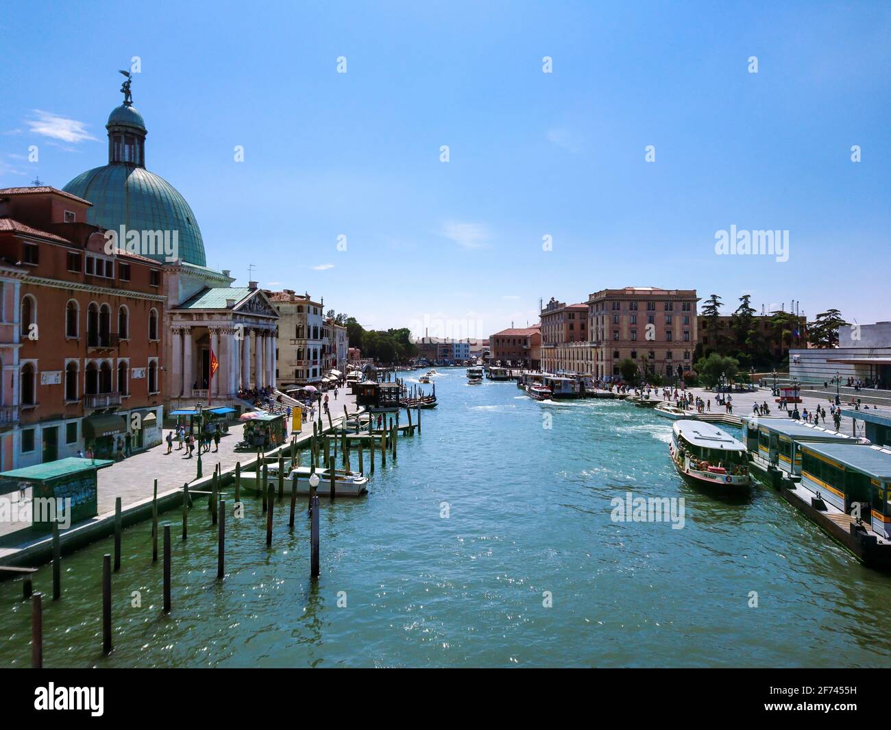 Venice, Italy - August 10, 2019: Grand canal near main train station and San Simeone Piccolo church with boats. Old buildings, blue water on sunny sum Stock Photo