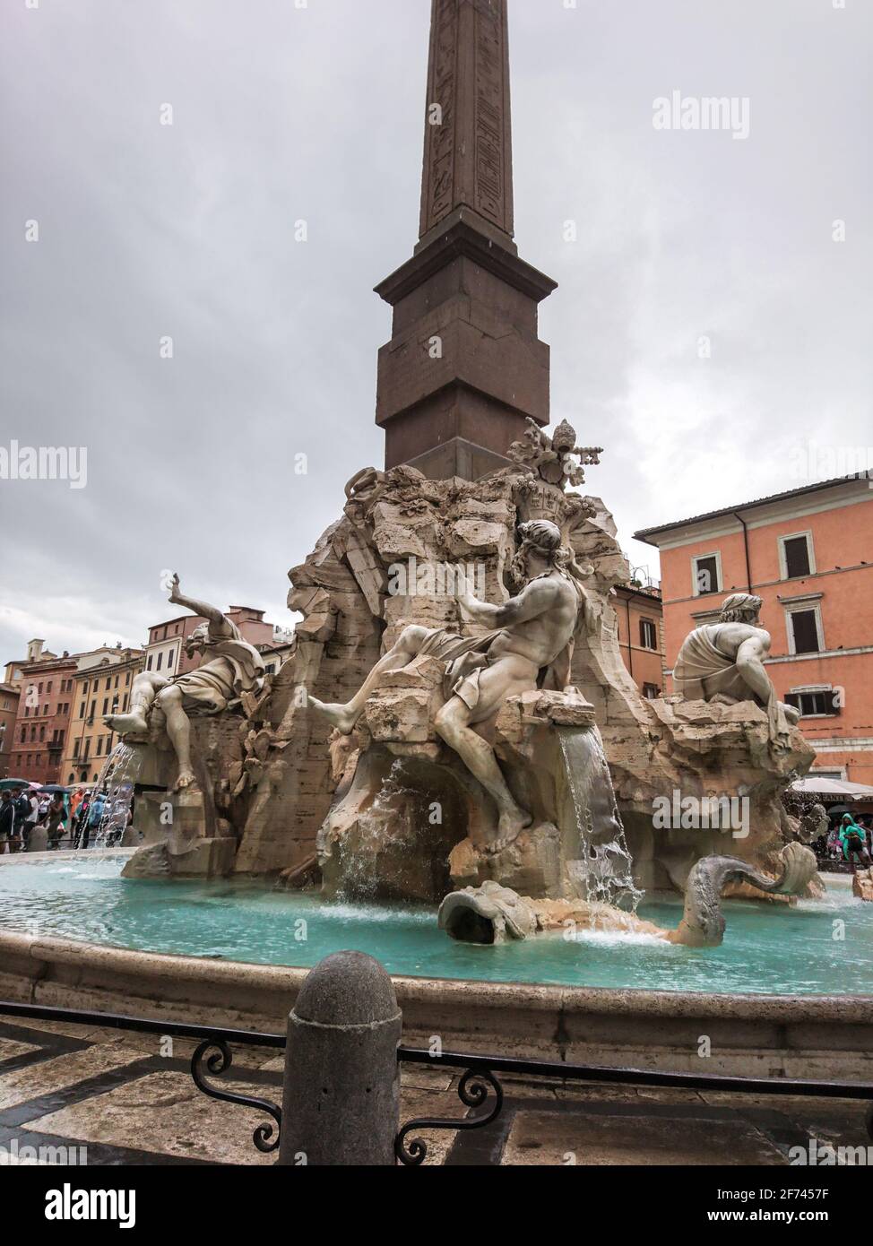 Rome, Italy - August 18, 2019: Bernini's Fountain of the Four Rivers with Obelisco Agonale, ancient obelisk in the center, close-up on cloudy day Stock Photo