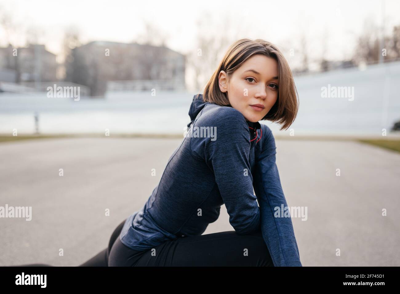 Portrait of cheerful woman posing for camera Stock Photo - Alamy