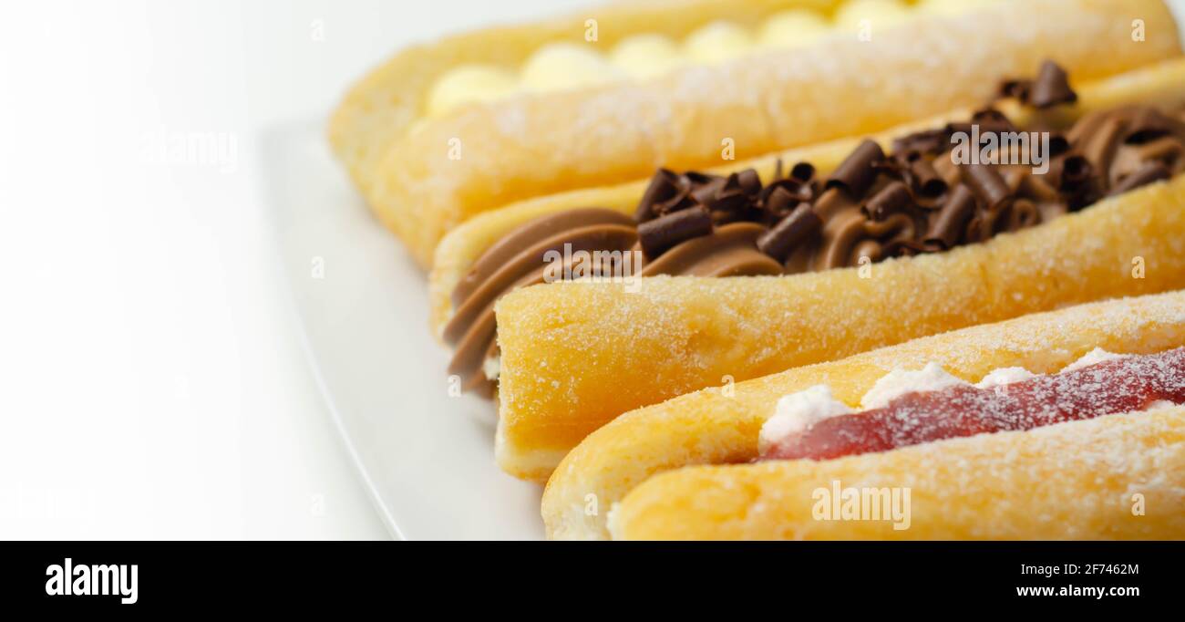 Mixed finger donuts filling chocolate, custard, jam and whipped cream