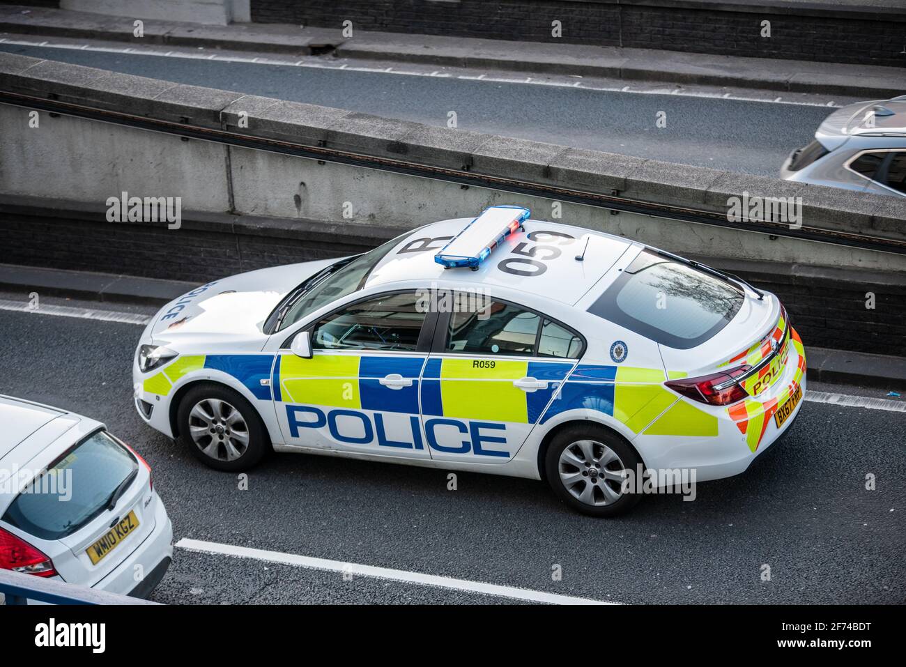 West Midlands Police Vauxhall Insignia keeping a lane closed for a road traffic collision in Great Charles Queensway tunnel, Birmingham, UK (not pictured). Stock Photo