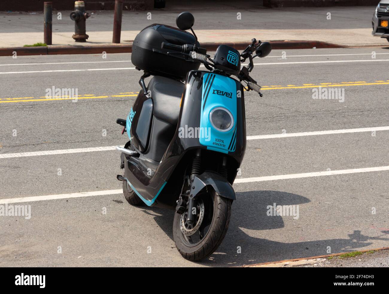 A Revel brand electric moped parked on a New York street, a electric bike and moped rental company for urban transportation Stock Photo