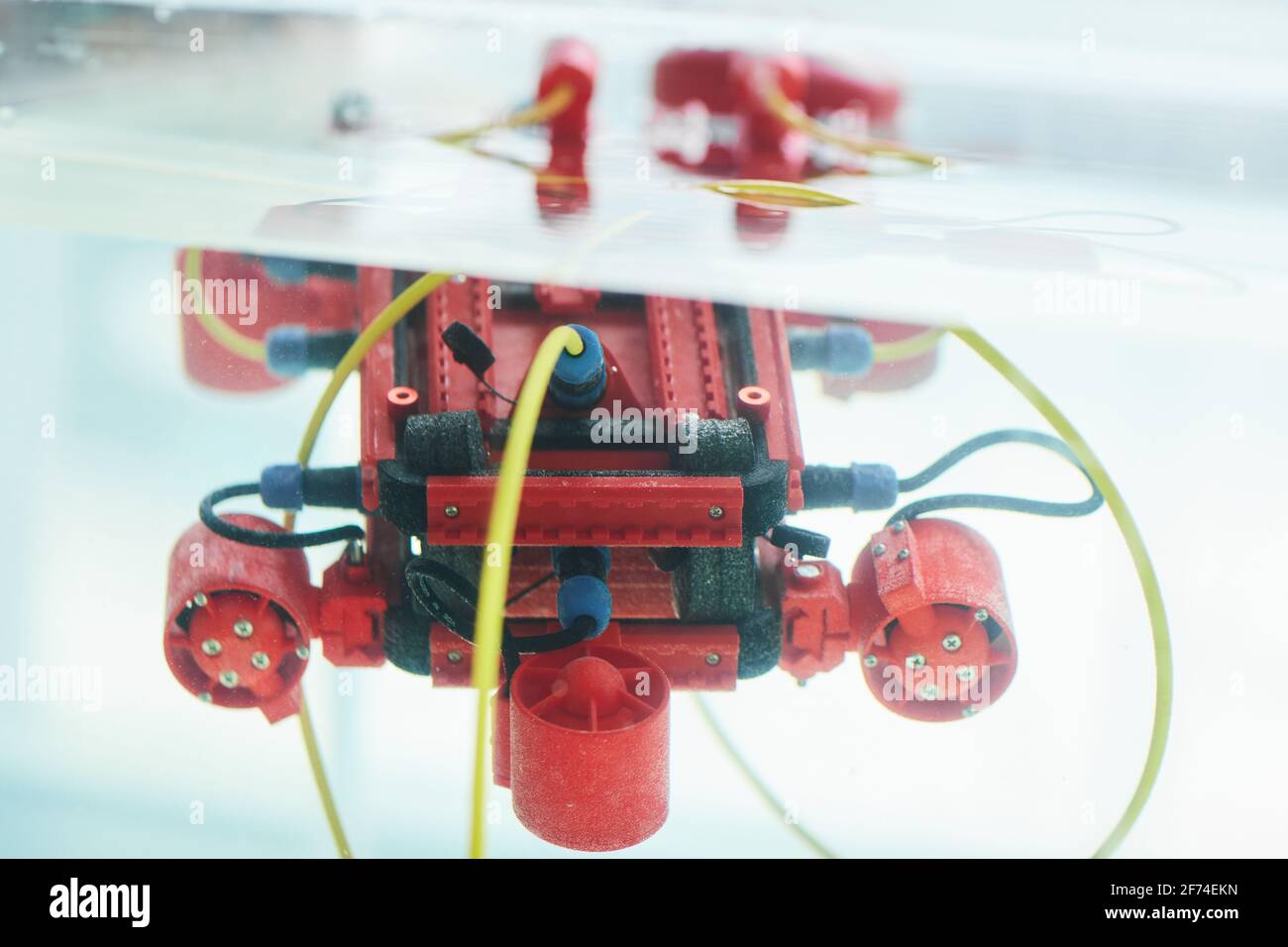 Close up background image of red robotic boat with camera in water tank ...