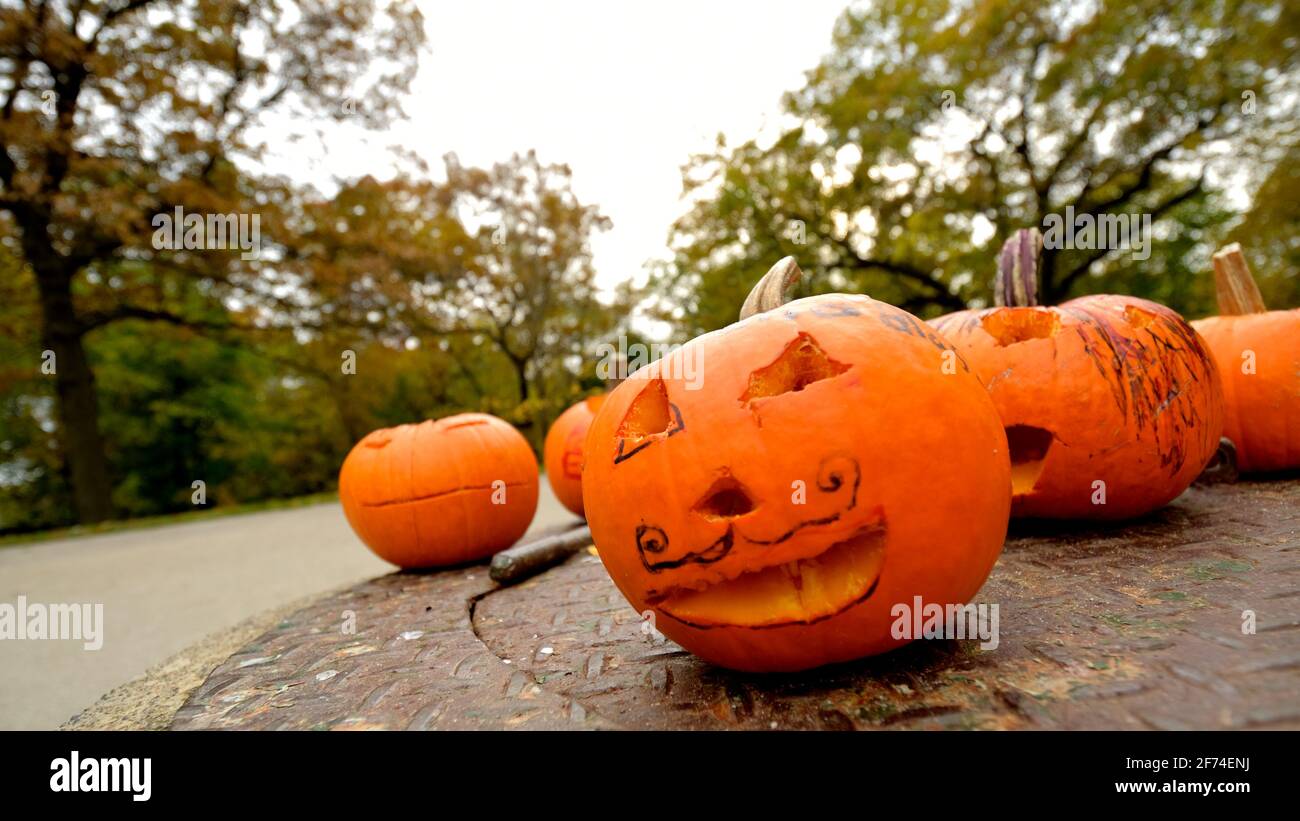 scary but comic Halloween jack-o'-lanterns pumpkins outdoors Stock Photo