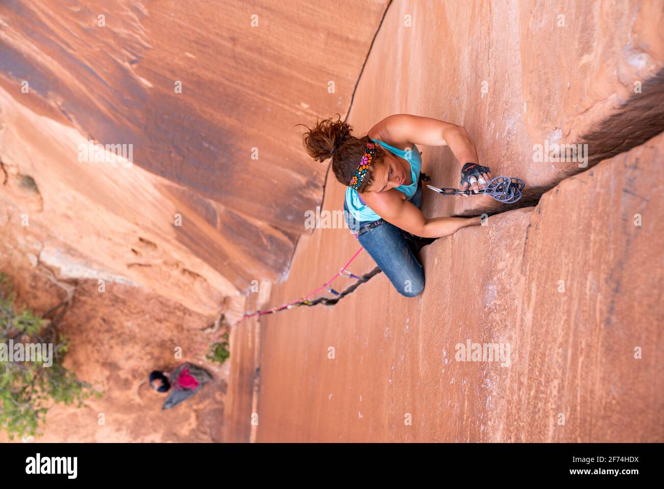Female Rock Climber Makes Her Way Up a Crack System in Grand Junction