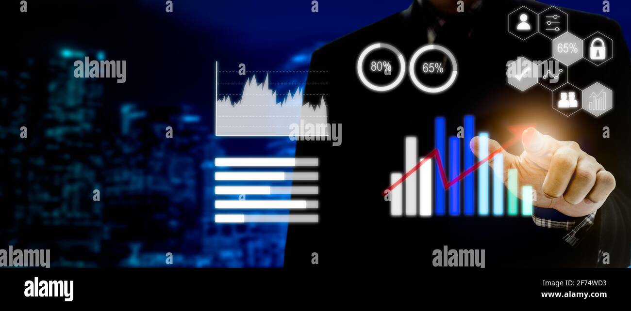 businessman touching digital business icon, graph and chart network connection on modern virtual interface. Stock Photo