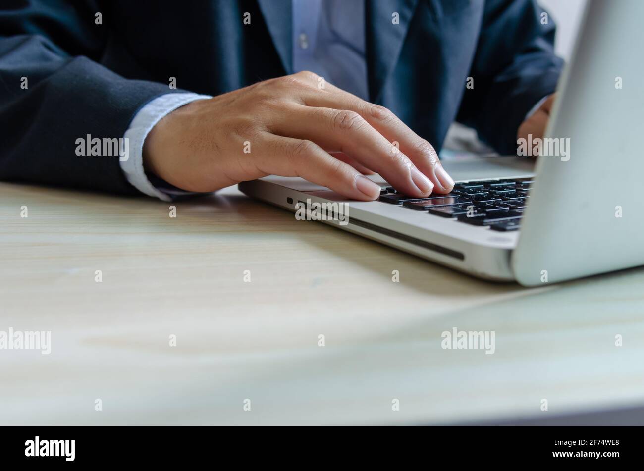business man typing on keyboard computer laptop. Stock Photo