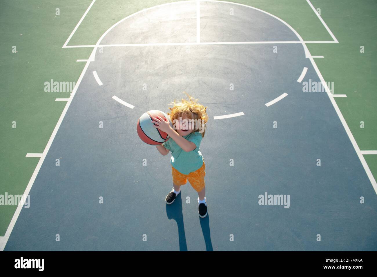 Kid Shooting The Ball High Resolution Stock Photography And Images Alamy