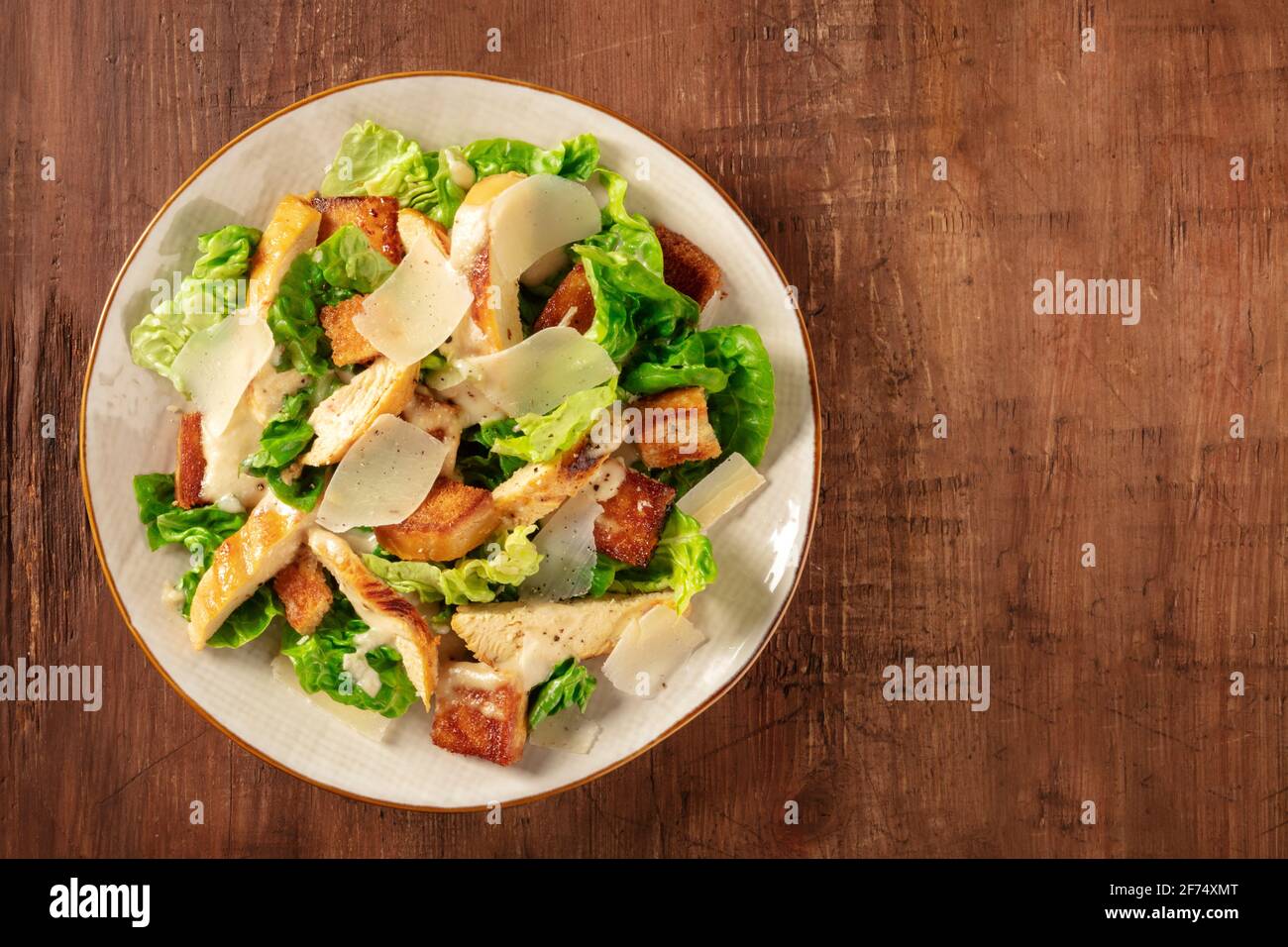 Caesar salad with chicken and Parmesan, overhead shot Stock Photo