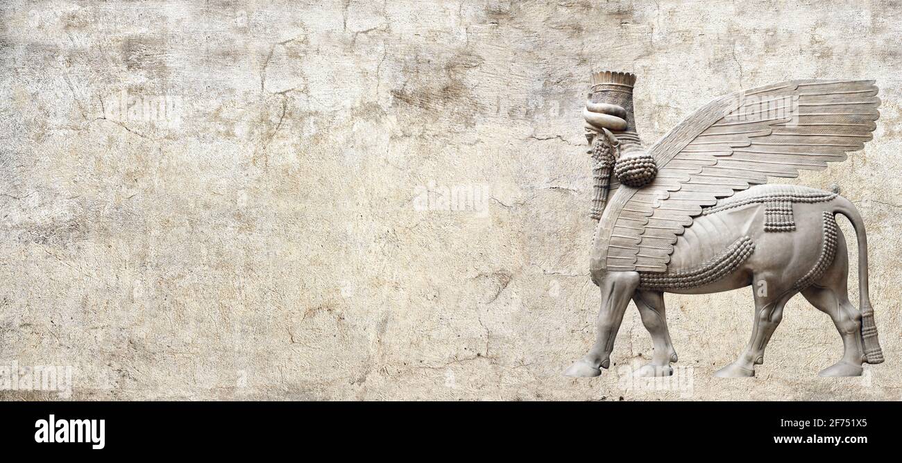 Grunge background with stone texture and lamassu - human-headed winged bull statue, Assyrian protective deity. Copy space for text. Mock up template Stock Photo