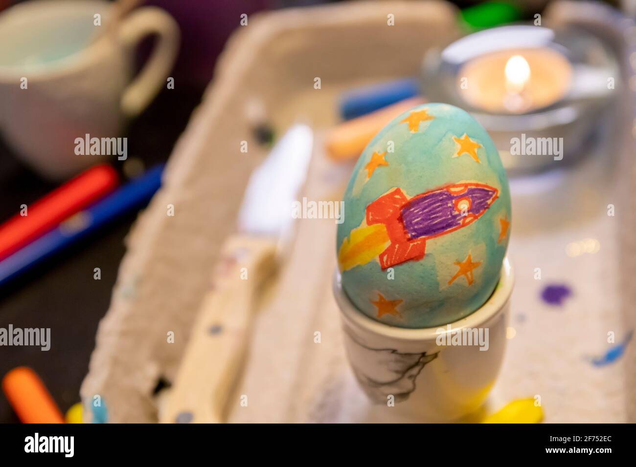 Easter egg painting and decorating activity concept: Colorful handmade Easter eggs. Preparation for the holidays. Stationary objects on the table. Stock Photo