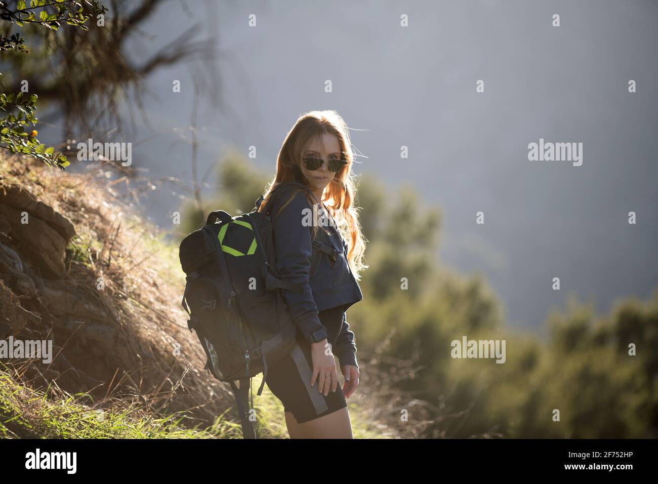 Girl hiker with backpack. Woman hiking in mountains with backpack ...