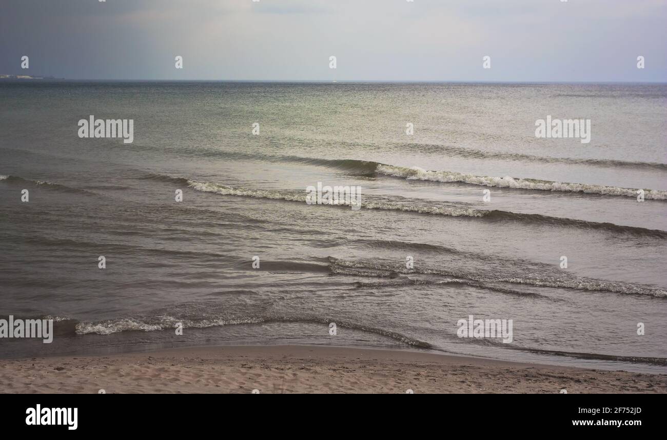 Rough waters before rain on a beach in Toronto, Ontario, Canada. Stock Photo