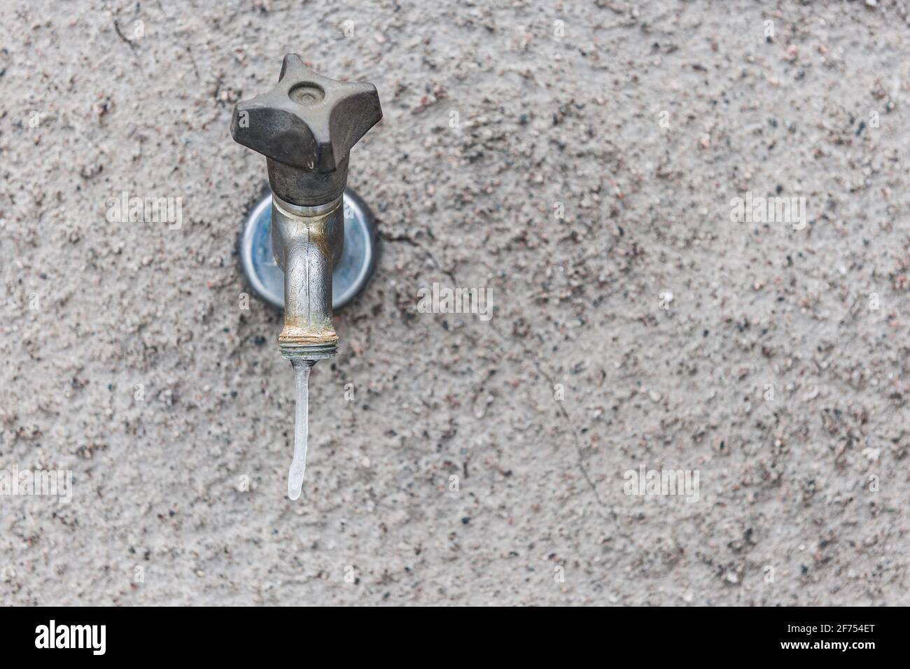 Frozen water tap on outside wall Stock Photo Alamy
