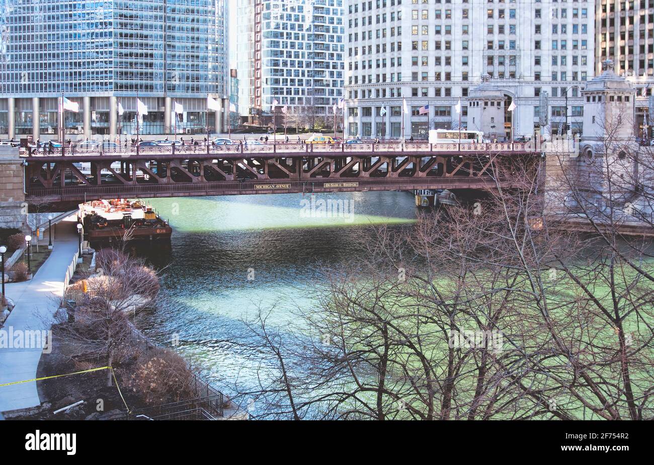 A bridge in Chicago looms over the Chicago River during spring. Stock Photo