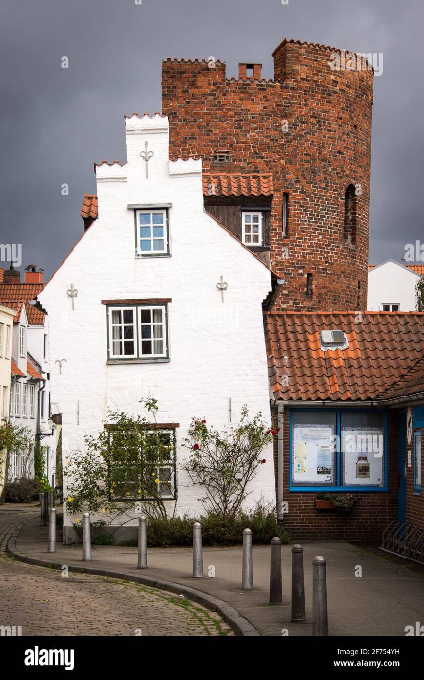 A half timbered house in Lübeck, integrated in a medieval round tower of the old town wall Stock Photo