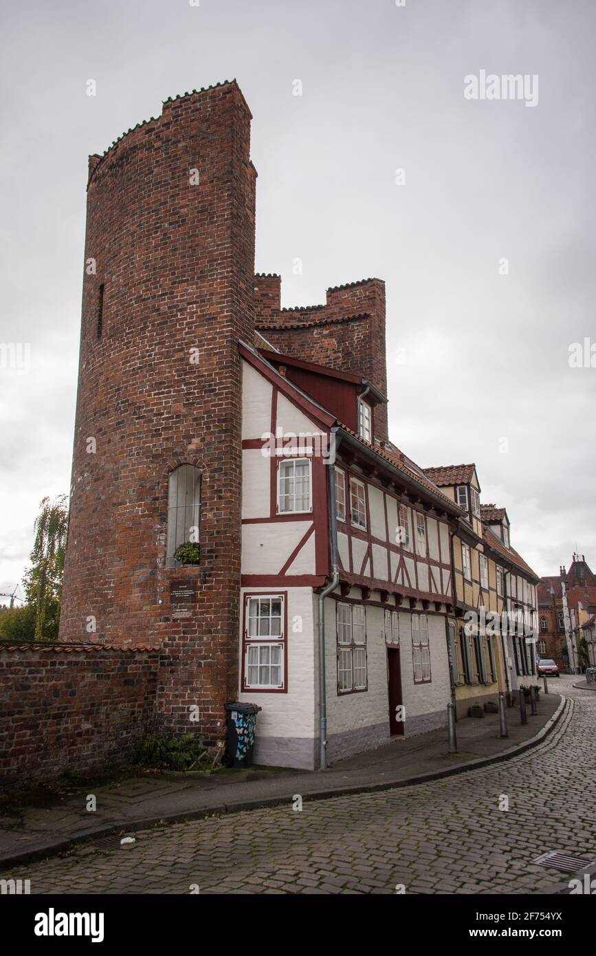 A half timbered house in Lübeck, integrated in a medieval round tower of the old town wall Stock Photo