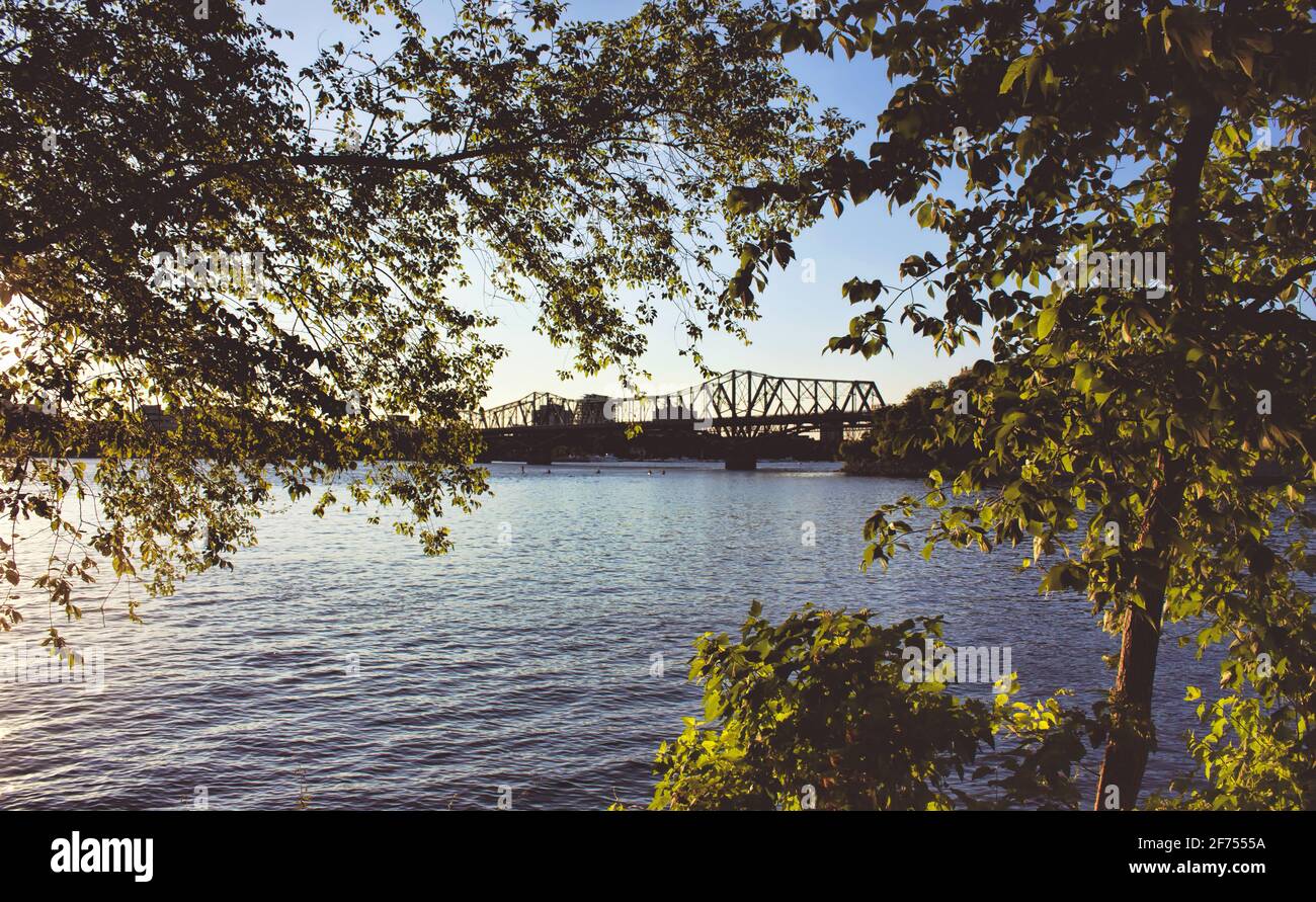 A bridge surrounded by water under a sunny sky in Ottawa, Canada. Stock Photo