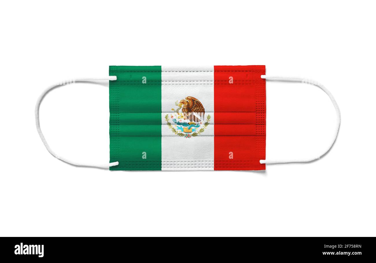 Flag of Mexico on a disposable surgical mask. White background isolated Stock Photo