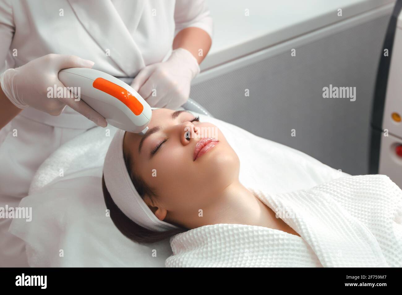 Hardware cosmetology. Cosmetology face procedure. ultraformer lifting. Stock Photo