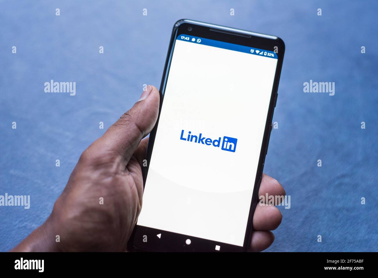 LinkedIn business network app loading on android smartphone Stock Photo