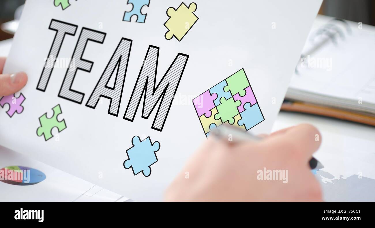 Team 2 Paper Unity puzzle showing team hi-res stock photography and images - Alamy