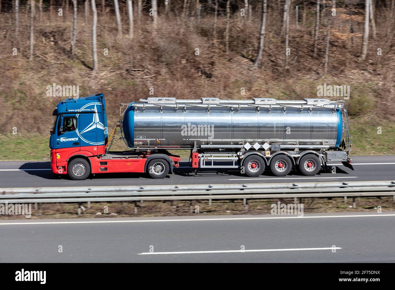 Bermes Mercedes-Benz truck with tank trailer on motorway. Stock Photo