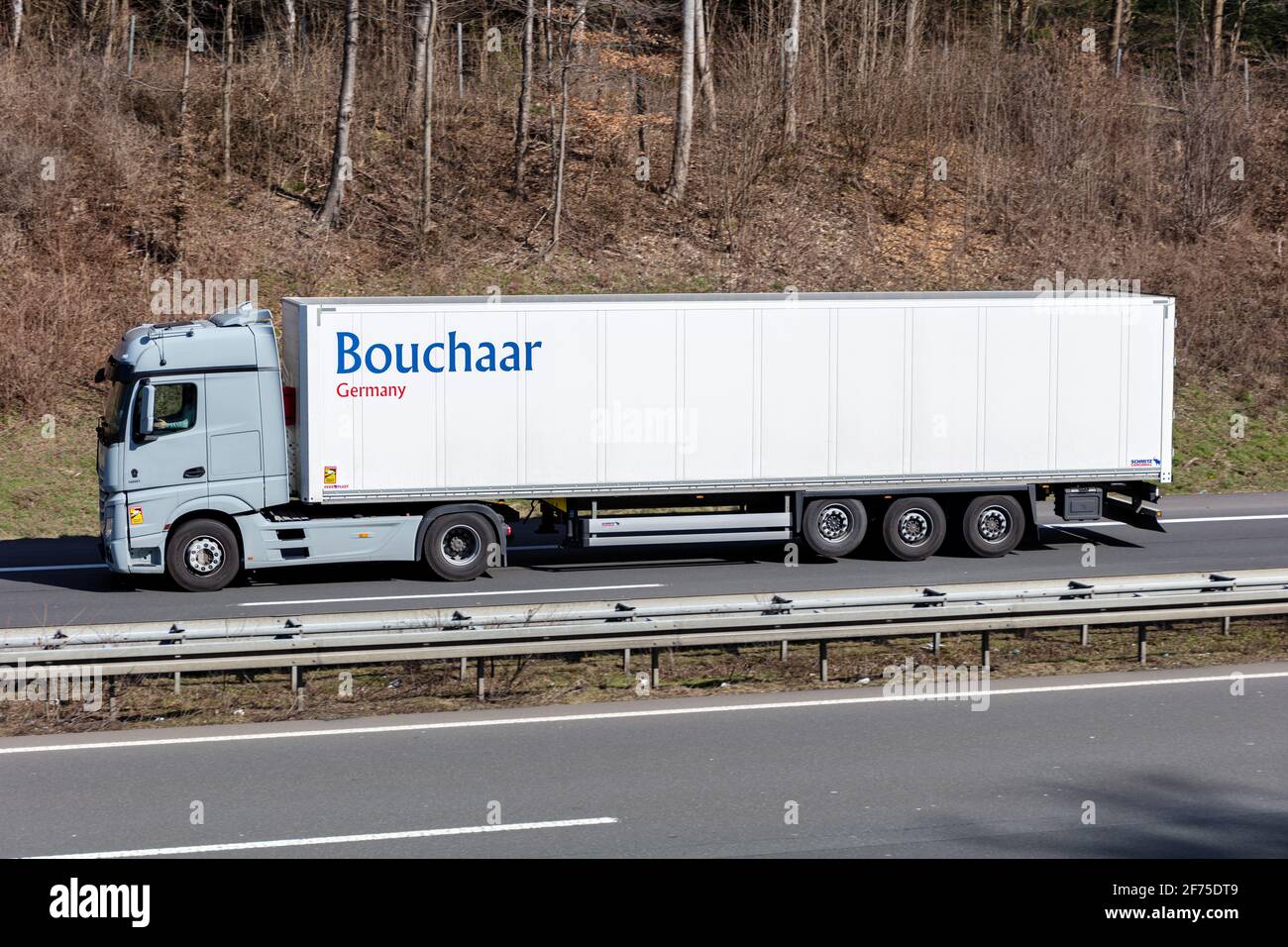 Bouchaar Mercedes-Benz Actros truck with box trailer on motorway. Stock Photo