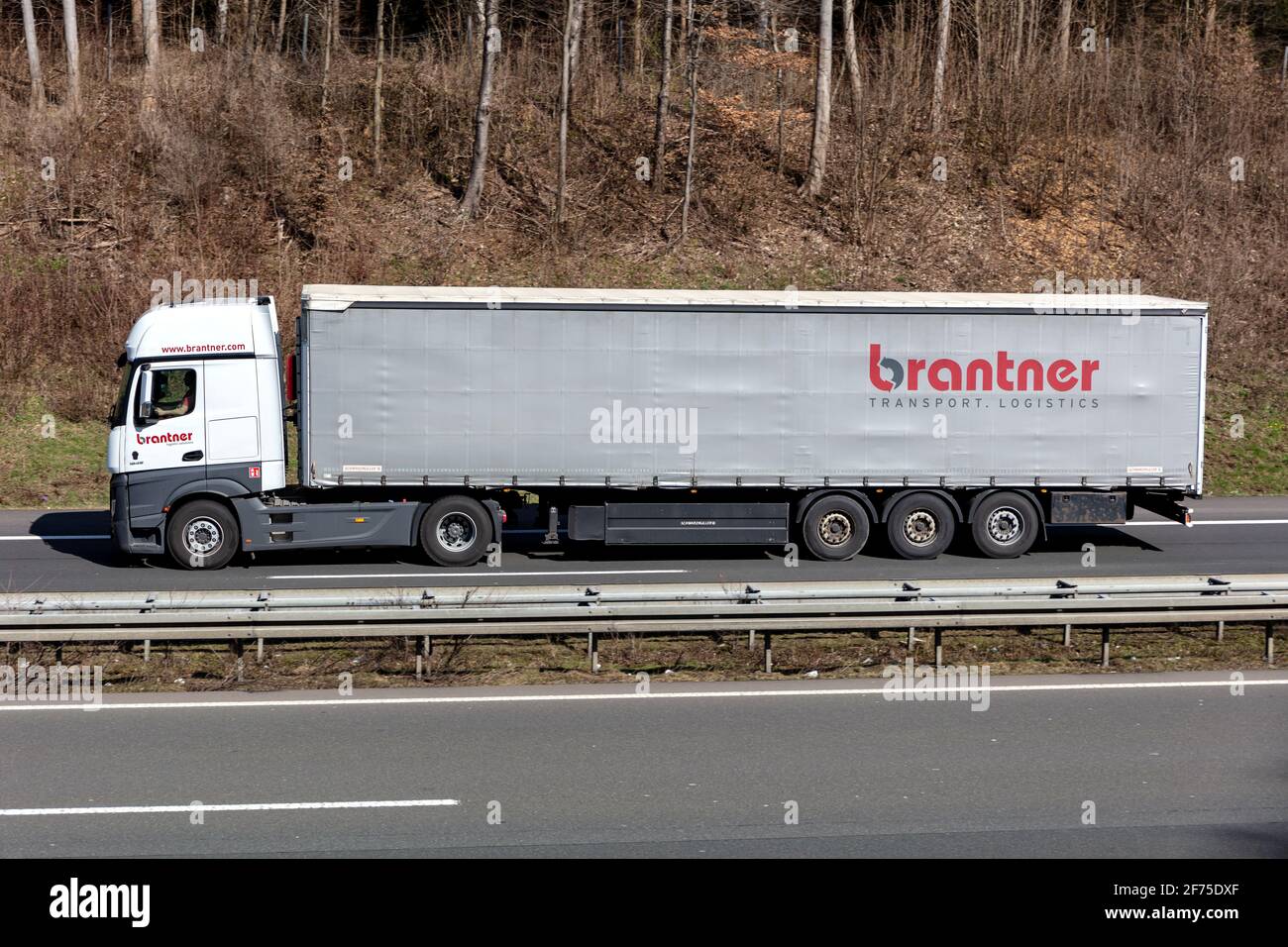 Brantner Mercedes-Benz Actros truck with curtainside trailer on motorway. Stock Photo
