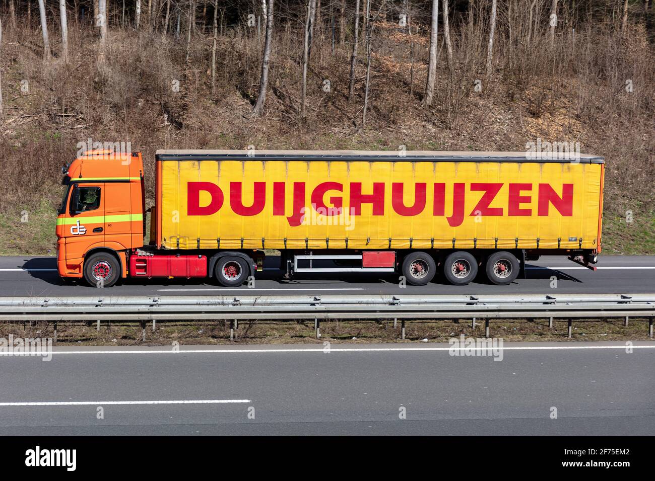 Duijghuijzen Mercedes-Benz Actros truck with curtainside trailer on motorway. Stock Photo