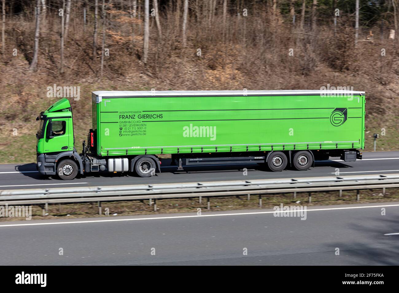 Franz Gierlichs Mercedes-Benz truck with curtainside trailer on motorway. Stock Photo