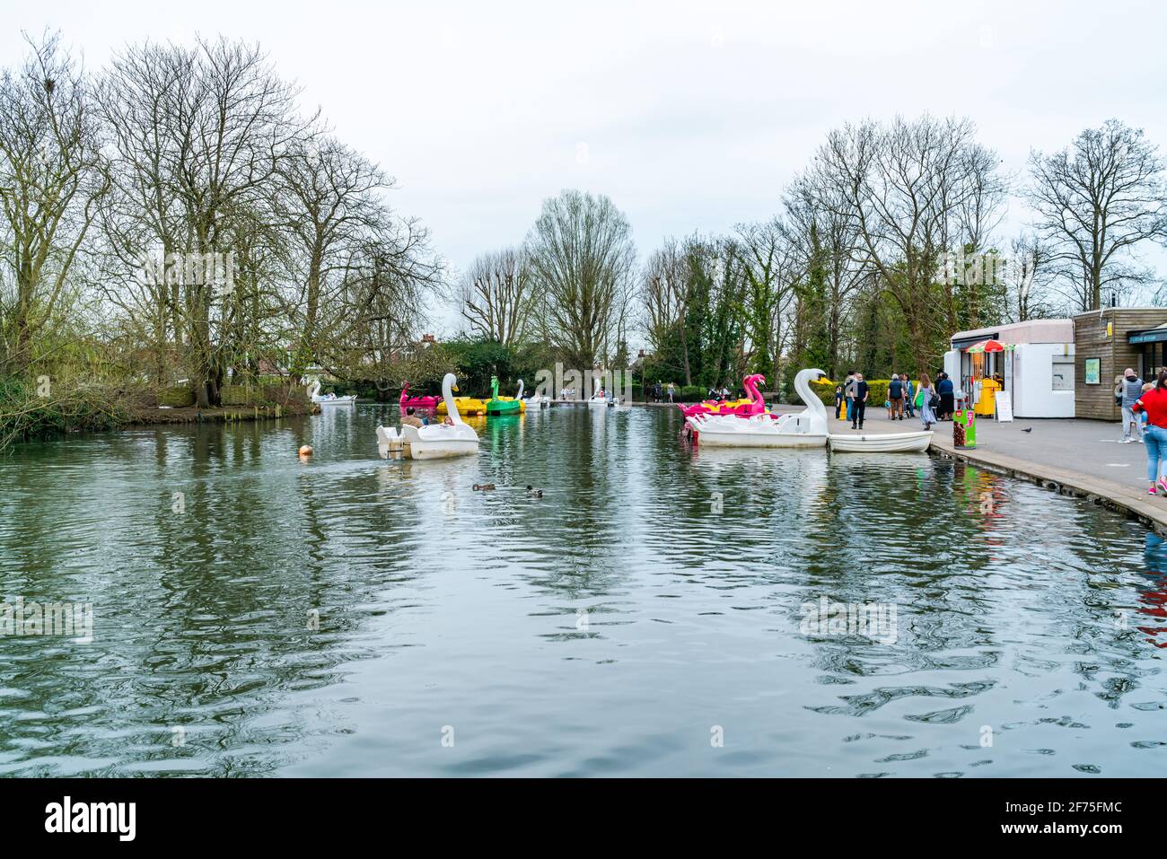 LONDON, UK MARCH 31 2021 View of boating lake with pedal boats on at