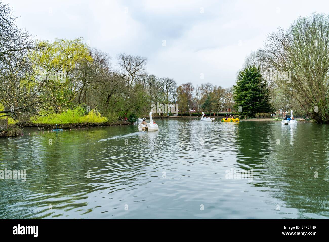 LONDON, UK MARCH 31 2021 View of boating lake with pedal boats on at