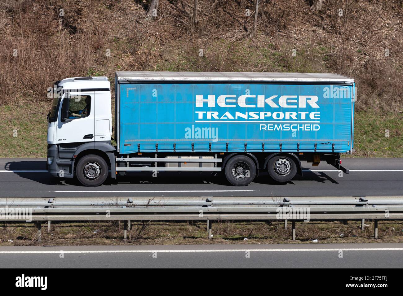 Hecker Transporte Mercedes-Benz truck on motorway. Stock Photo