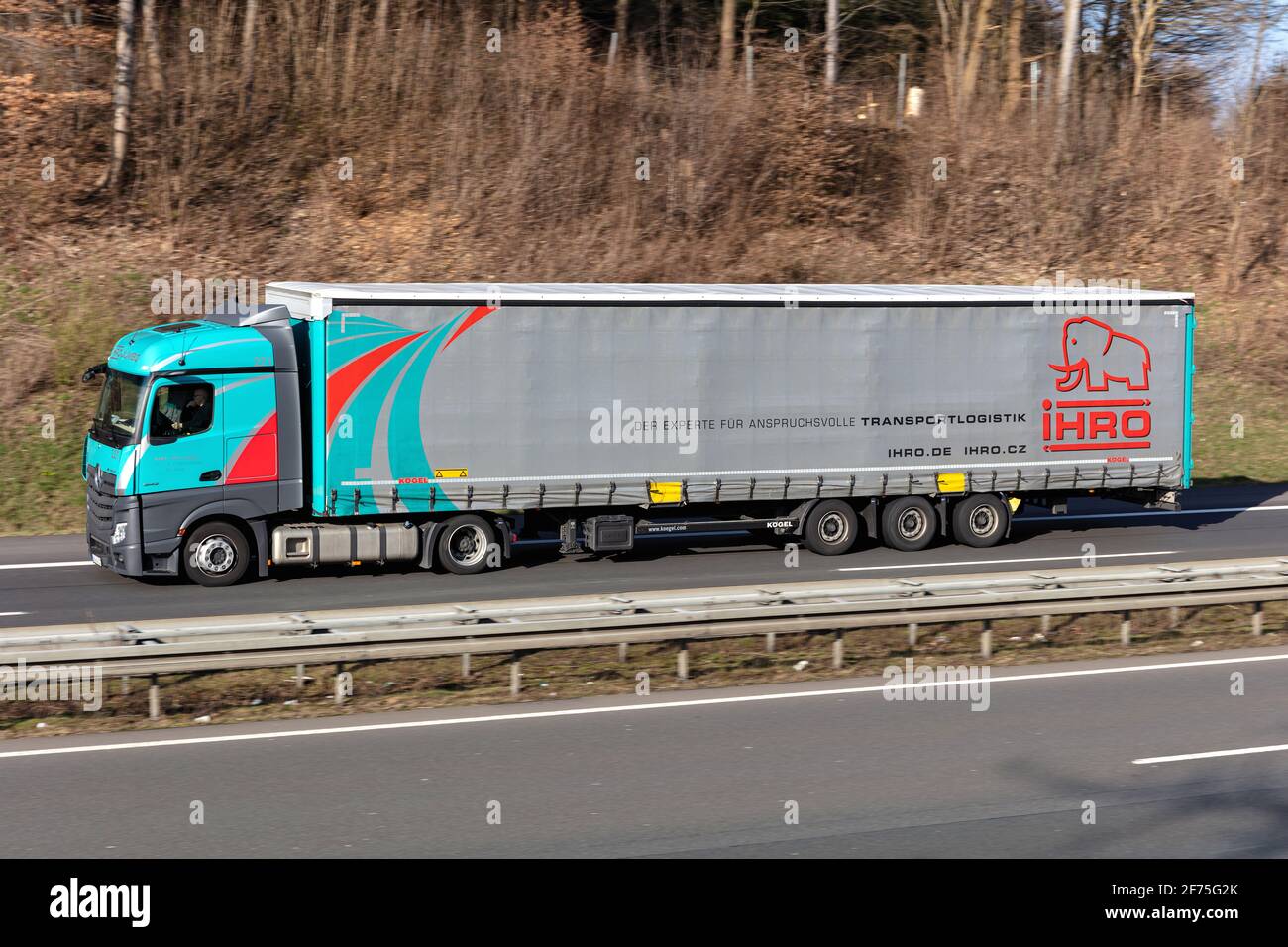 IHRO Mercedes-Benz Actros truck with curtainside trailer on motorway. Stock Photo